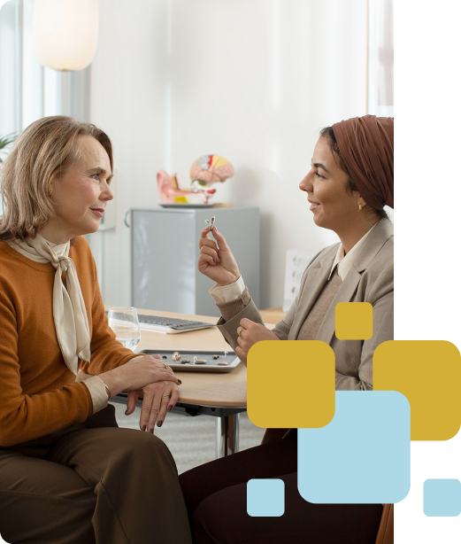Elderly woman with hearing aid